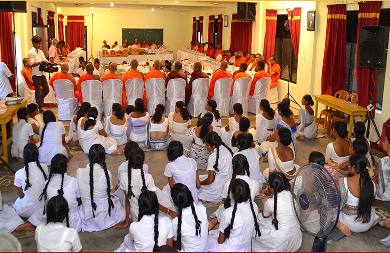 An Alms giving to Sangha was held at School premises